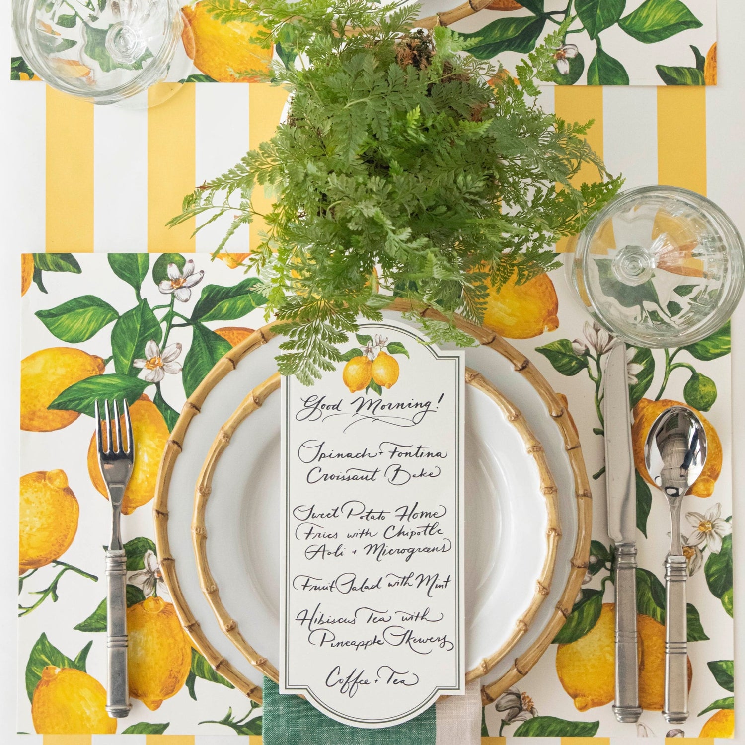 The Lemon Placemat under a bright summer-themed place setting, from above.