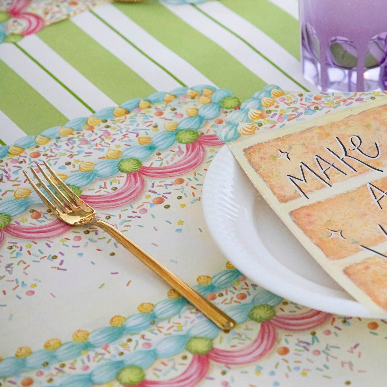 Close-up of the Die-cut Birthday Cake Placemat under a birthday place setting, showing the cake artwork.