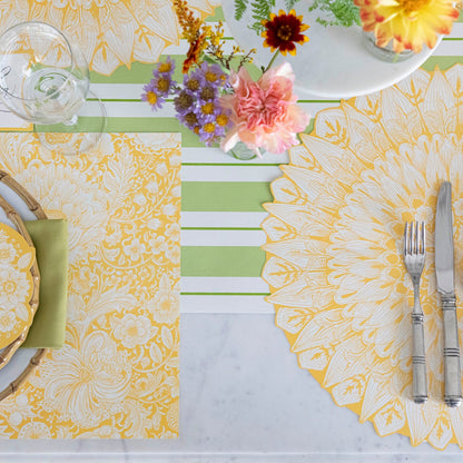 Green Awning Stripe Runner under a floral table setting.