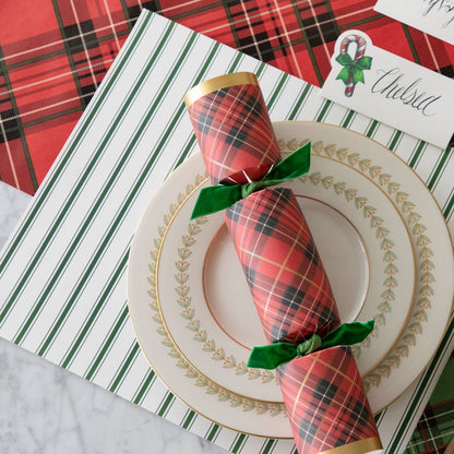 The Green Ribbon Stripe Placemat under an elegant table setting.