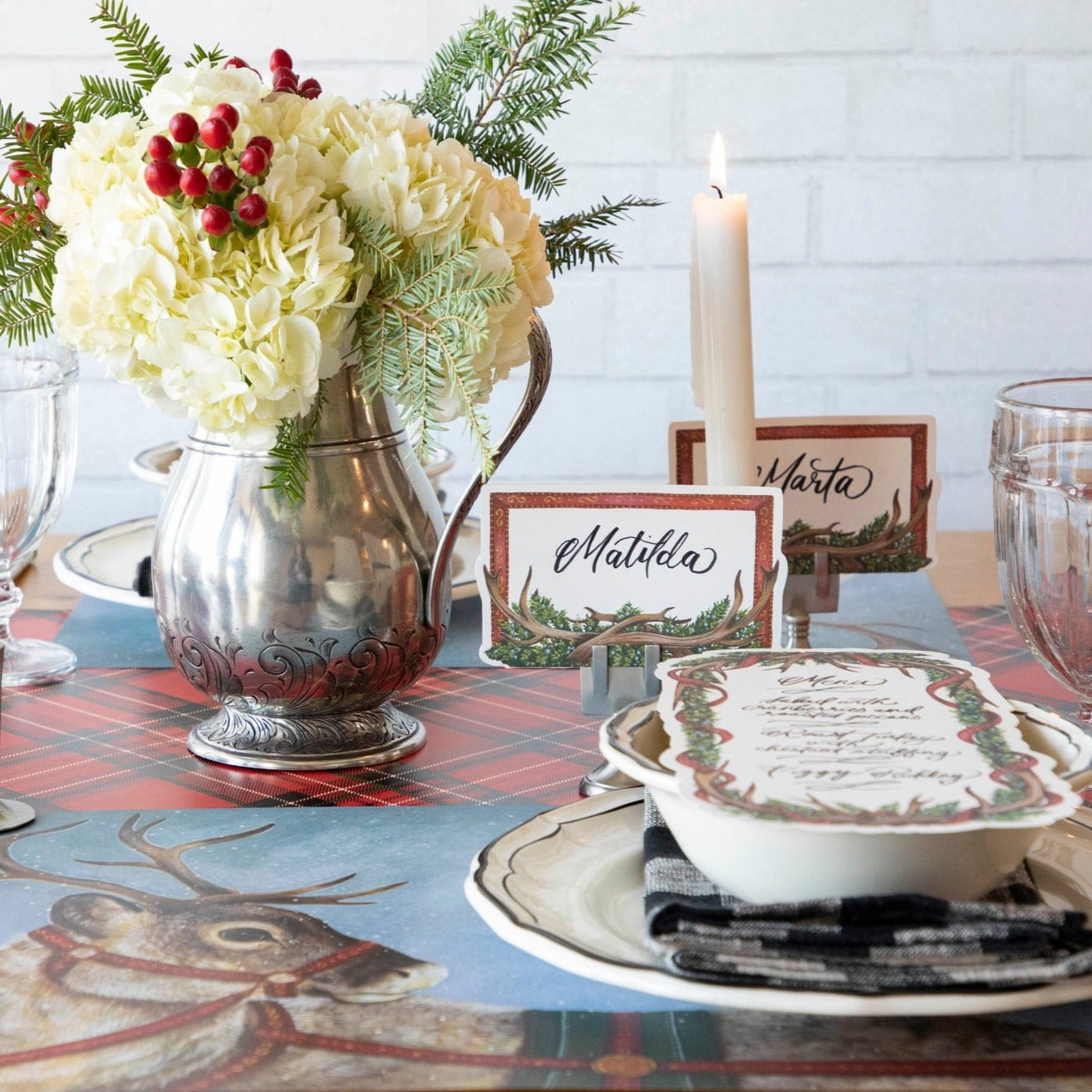 The Red Plaid Runner under an elegant Christmas-themed table setting.