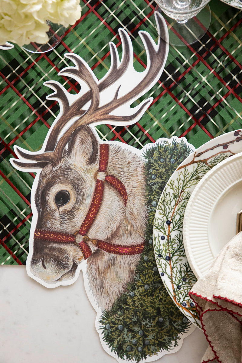 The Die-cut Reindeer Placemat under a festive Christmas place setting.