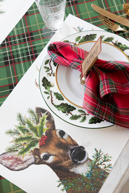 The Deer To Me Placemat under a festive holiday place setting.