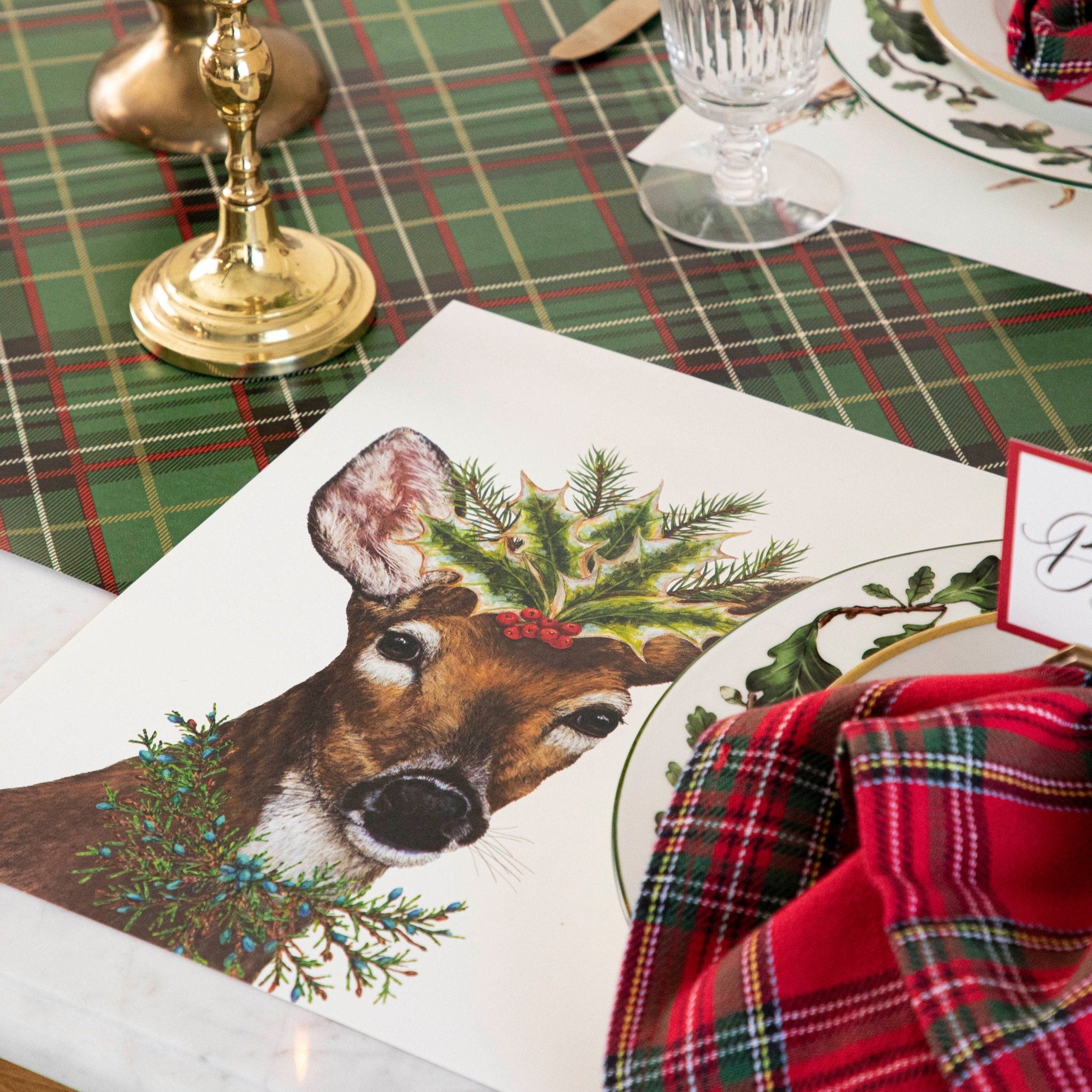 An elegant, festive table setting featuring the Deer to Me Placemat on the Green Plaid Runner.