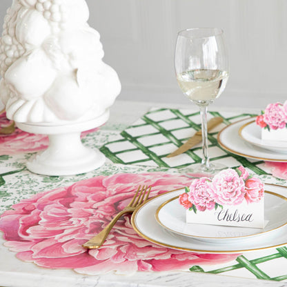 The Die-cut Peony Placemat under an elegant floral place setting.