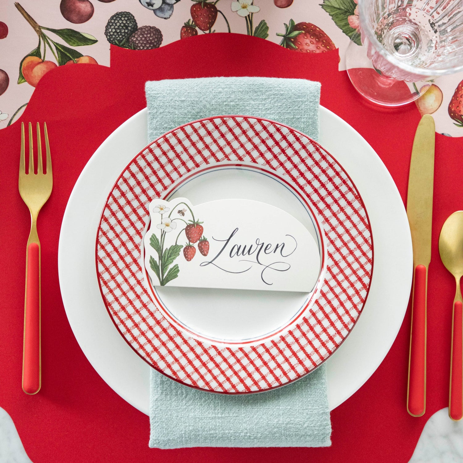 Die-cut Red French Frame Placemat under a spring place setting.