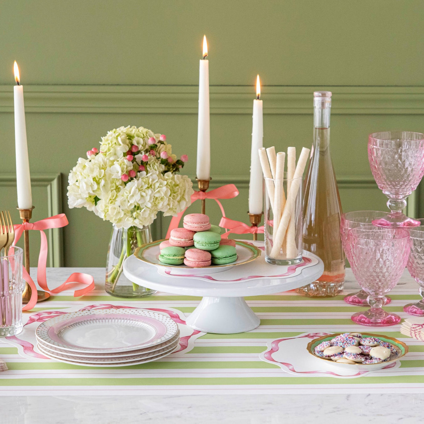 Pink Bow Serving Papers under various treats on a plate, on a spring themed table.