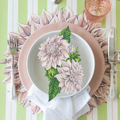 Die-cut Dahlia Placemat on the Green &amp; Pink Awning Stripe Runner under a place setting for one.