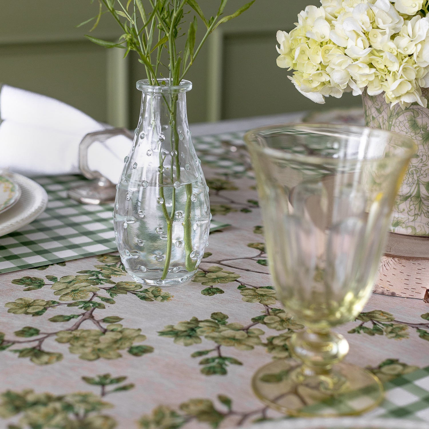 Green Cherry Blossom Runner under a spring table setting with vases.