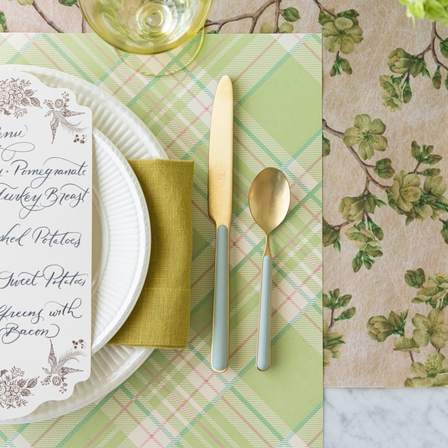 Bright Green Plaid Placemat on the Green Cherry Blossom runner, with a place setting for one on top.