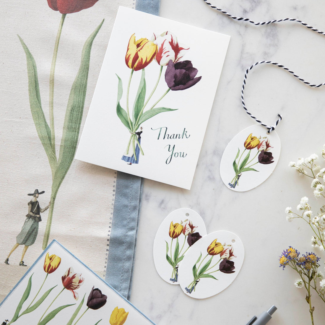 Hester &amp; Cook Tulips in a vase on a white background, accompanied by elegant Tulips Gift Tags.