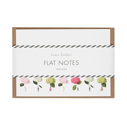 The Flat Notes set in retail packaging, showing the white cards and included kraft paper envelopes wrapped in a white paper belly band.