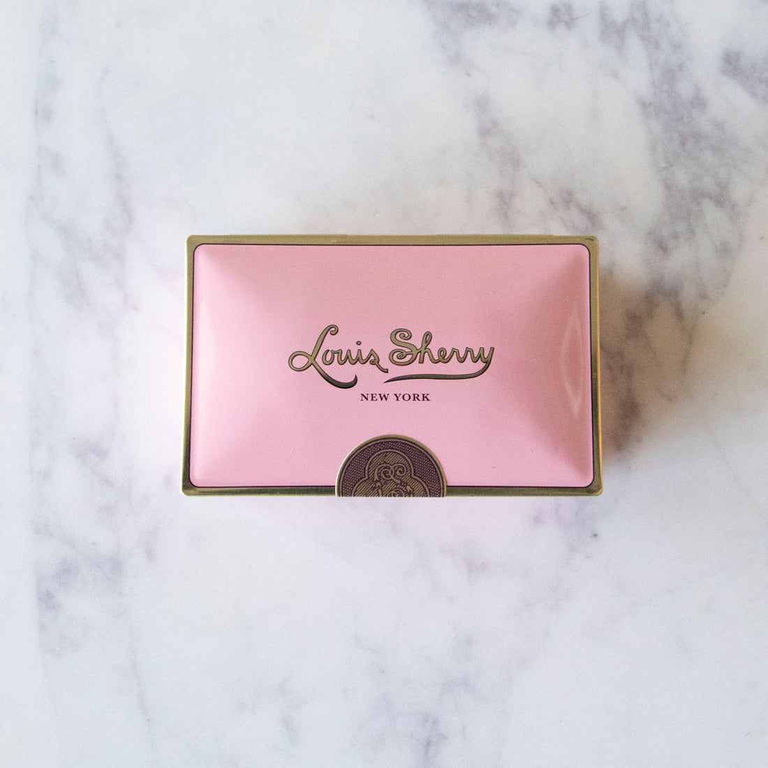 2-Piece Camellia Louis Sherry Chocolate Box on a marble table.