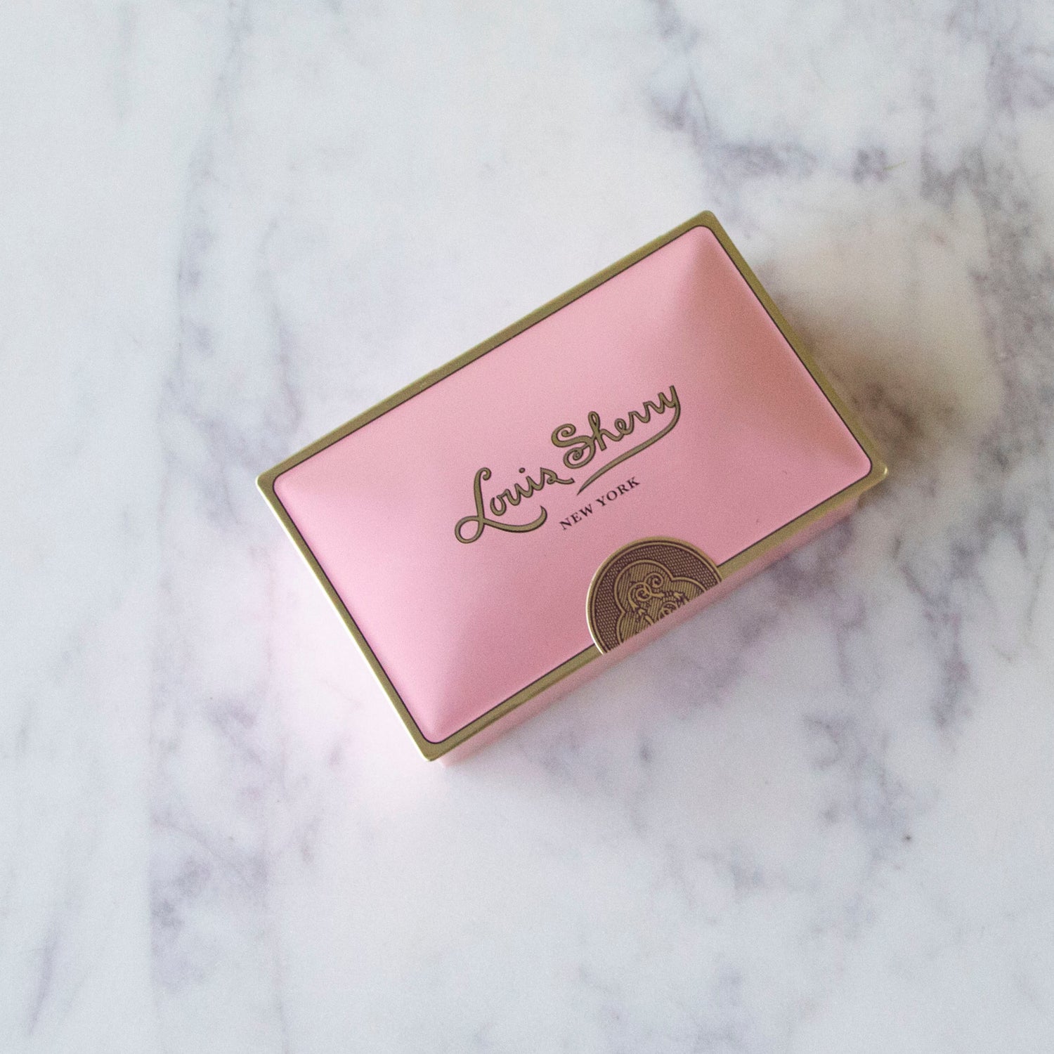 2-Piece Camellia Louis Sherry Chocolate Box on a marble table.