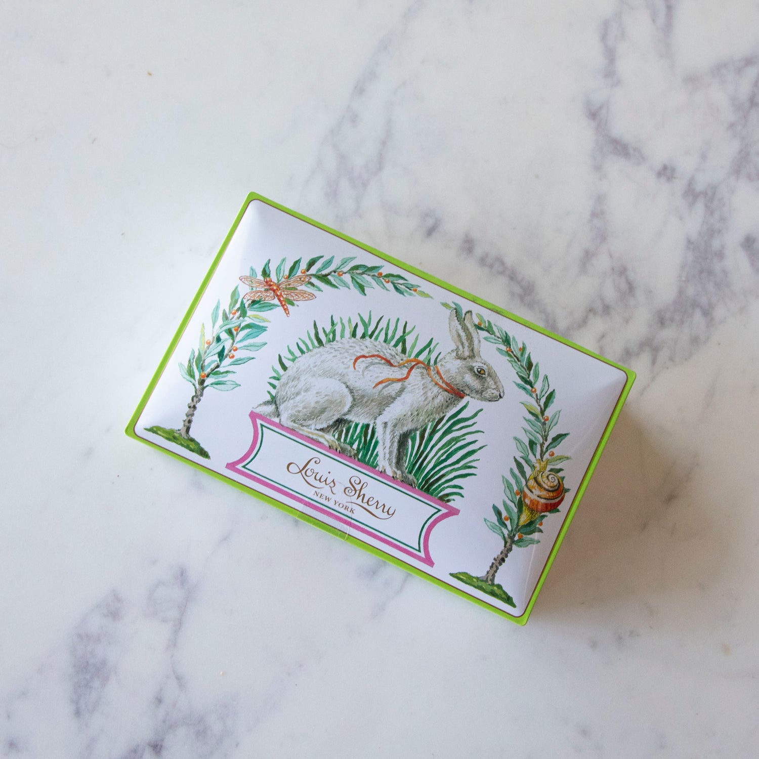 12-Piece Harrison Howard Bunny Rabbit Louis Sherry Chocolate Box on a marble table.