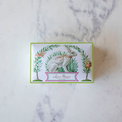 12-Piece Harrison Howard Bunny Rabbit Louis Sherry Chocolate Box on a marble table.