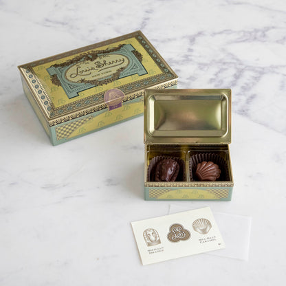 Inside detail of Louis Sherry Vintage Chocolate 2-piece box and 12-piece box in background. 