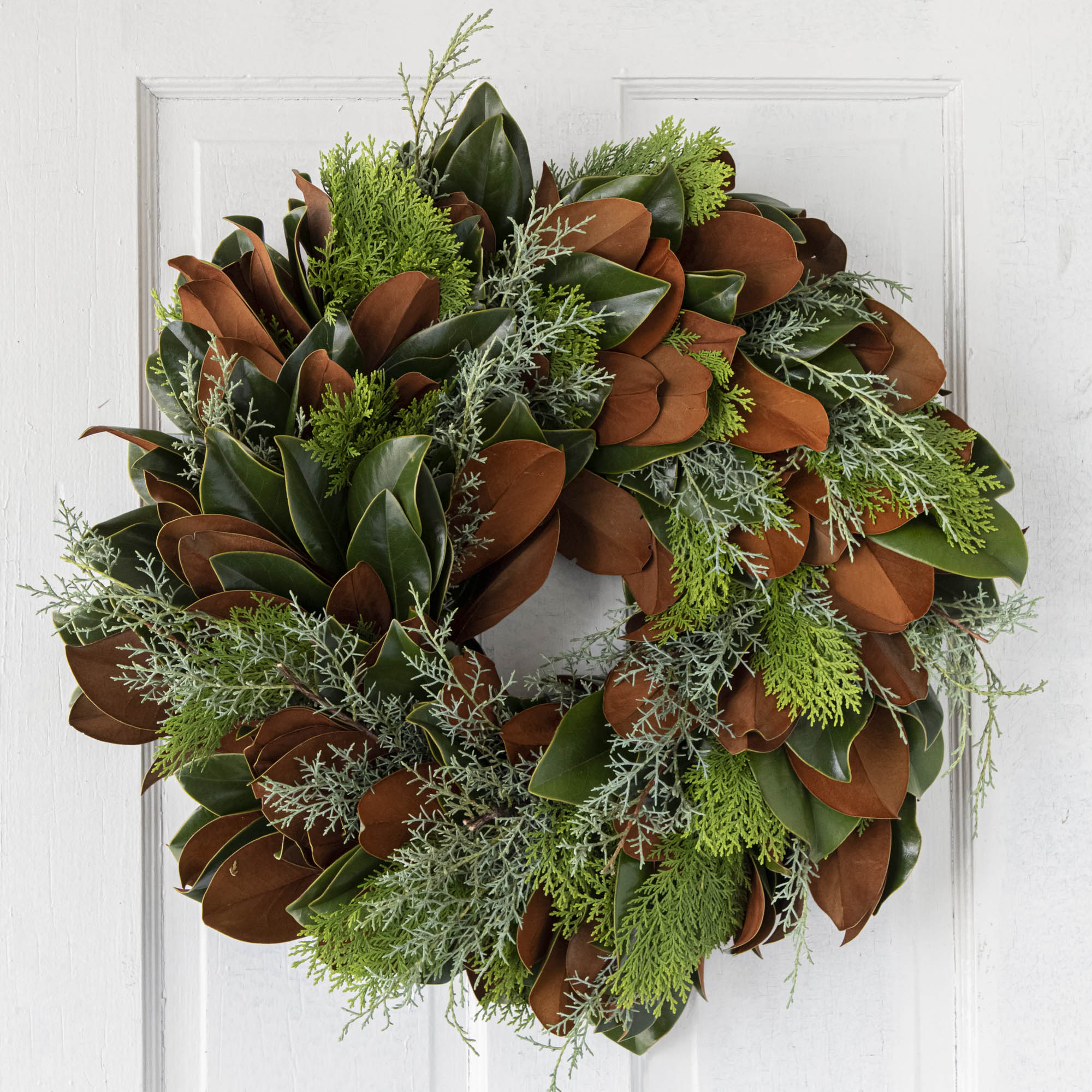 fresh bunches wreath hanging on door