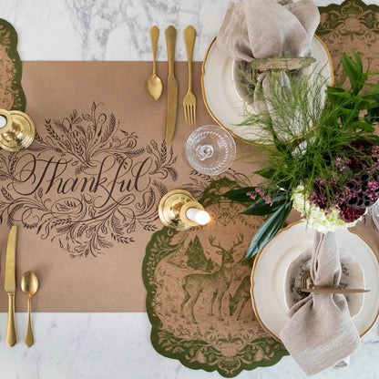 he Die-cut Moss Fable Fauna Placemat under an elegant Thanksgiving table setting, from above.