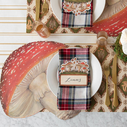 Mushroom placemats styled on a table with dinnerware.