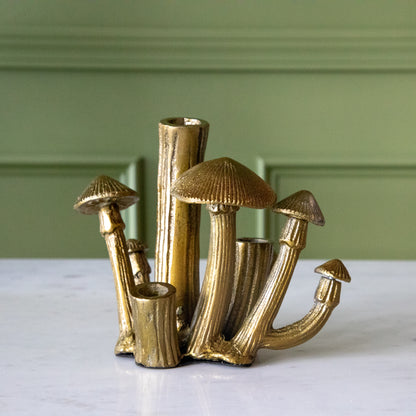 A Clustered Mushroom Budvase on a marble table.