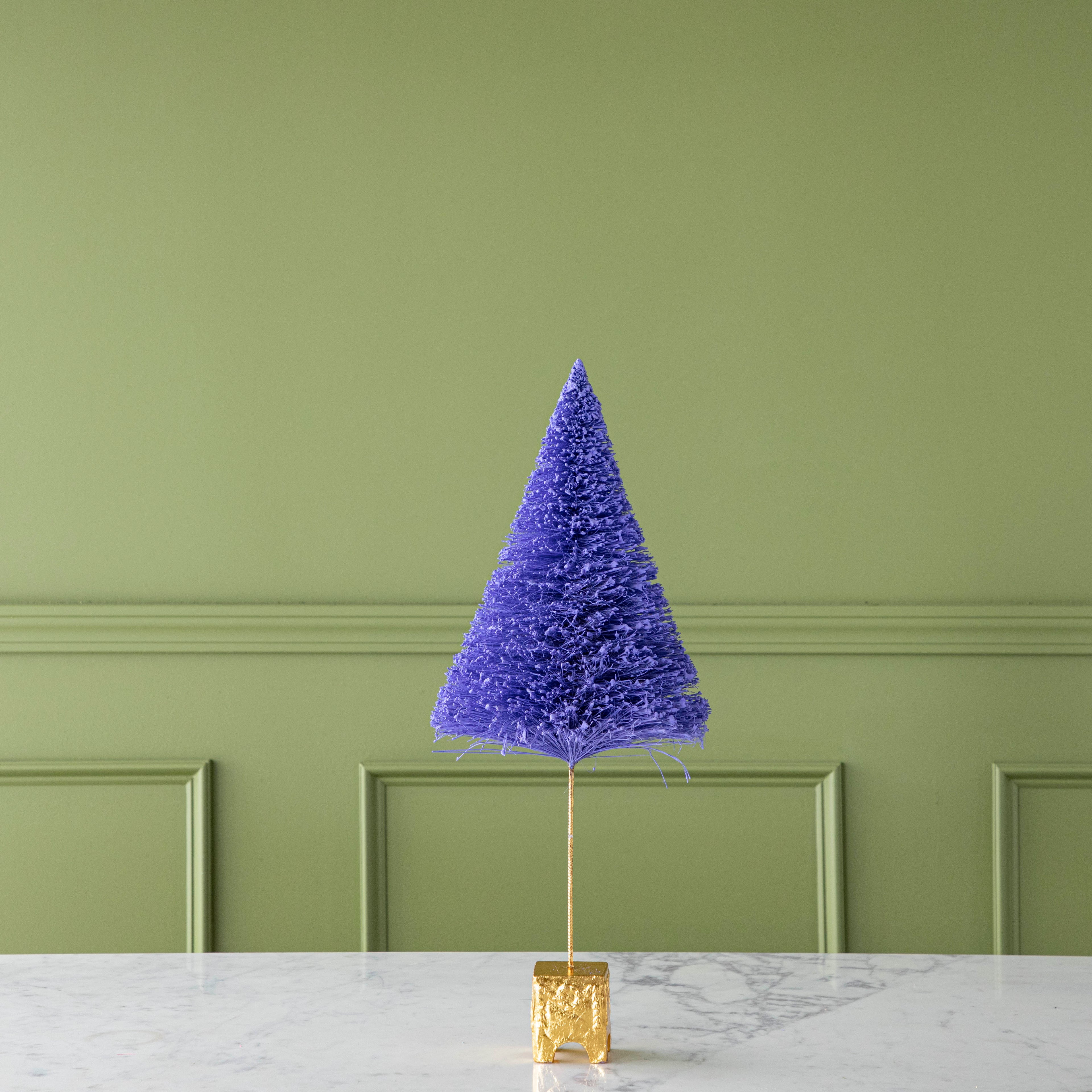 A 22&quot; Ultra Violet French Forest Sisal Tree with a gold base, on a marble table.