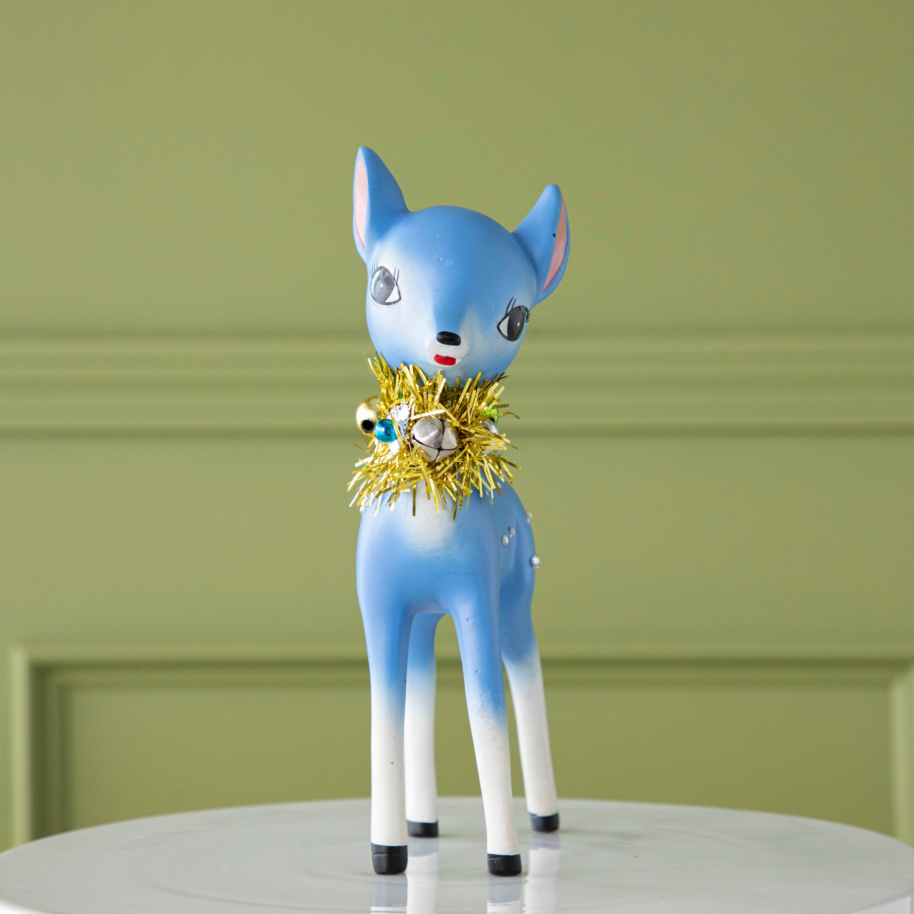 The blue Retro Reindeer on a cake stand.