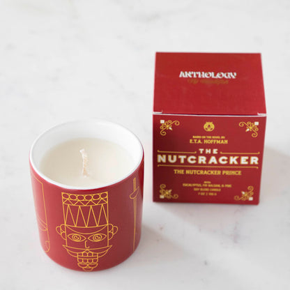 The Nutcracker Prince Candle next to the box it comes in.