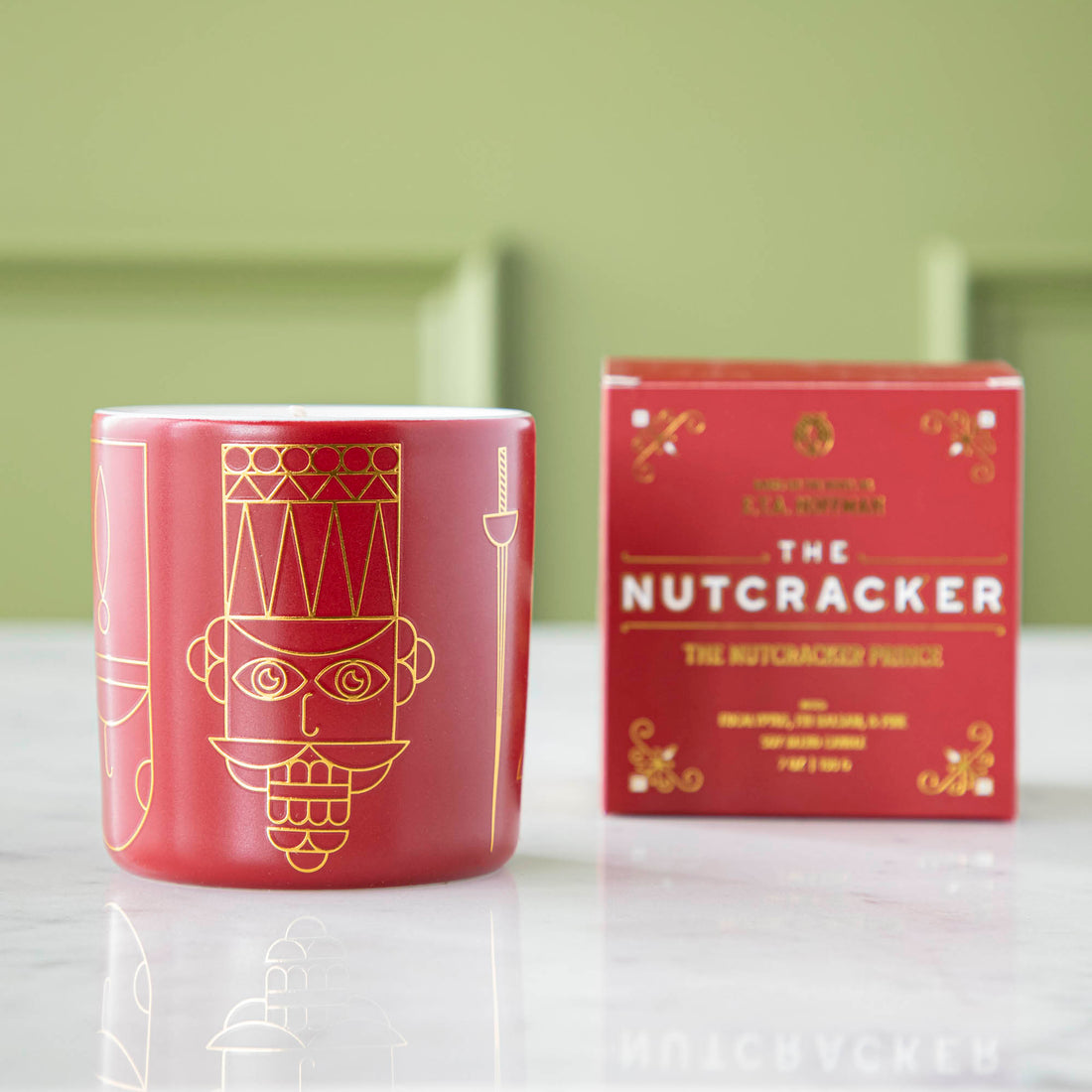 The Nutcracker Prince Candle next to the box it comes in.