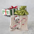 tea towel with mouse wearing a Santa hat holding a candy cane with wrapped gifts above it. 