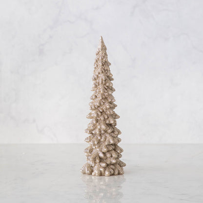 Two small Glitterville Champagne Tall Glitter Trees on a white table.