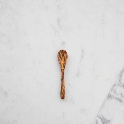 A set of nonporous Natural Olivewood Olivewood Spoons with lemons and salt.