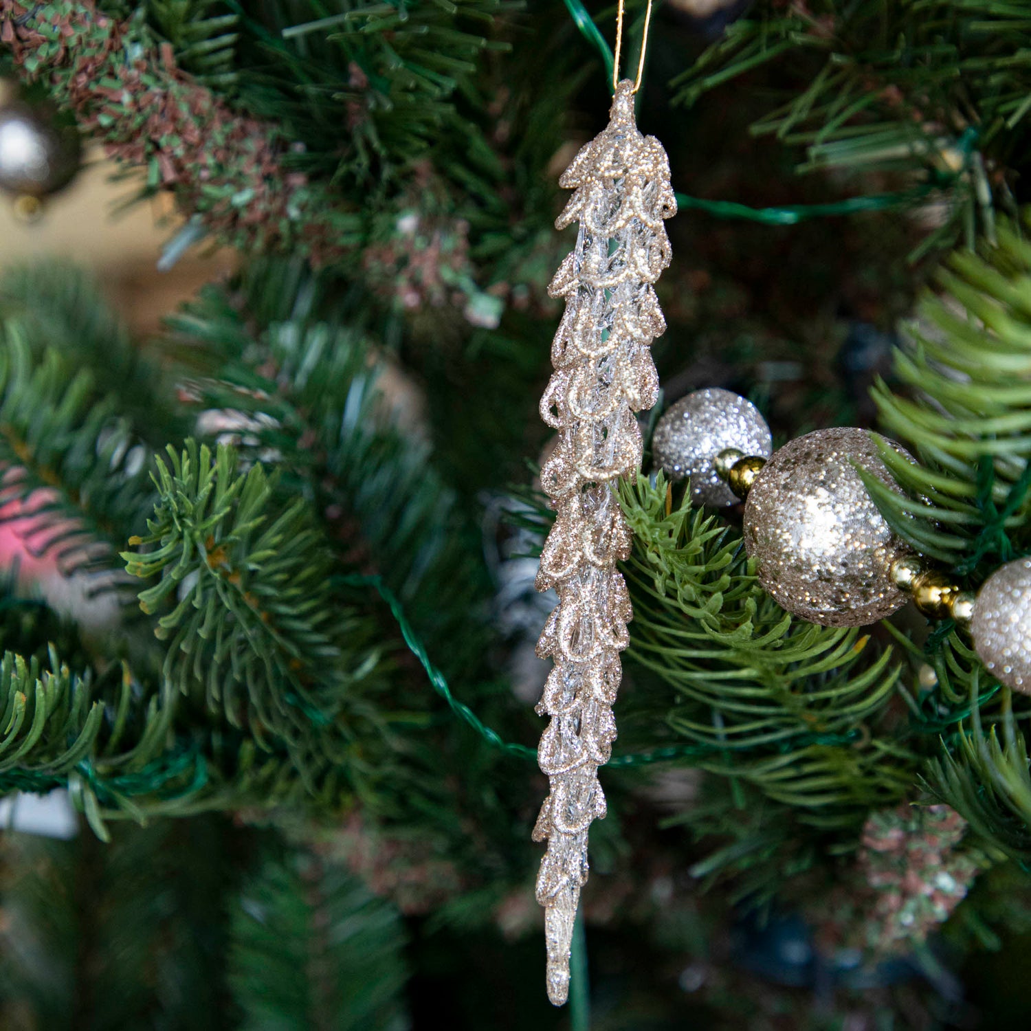 Spun Glass Icicle in Champagne Gold Glitter