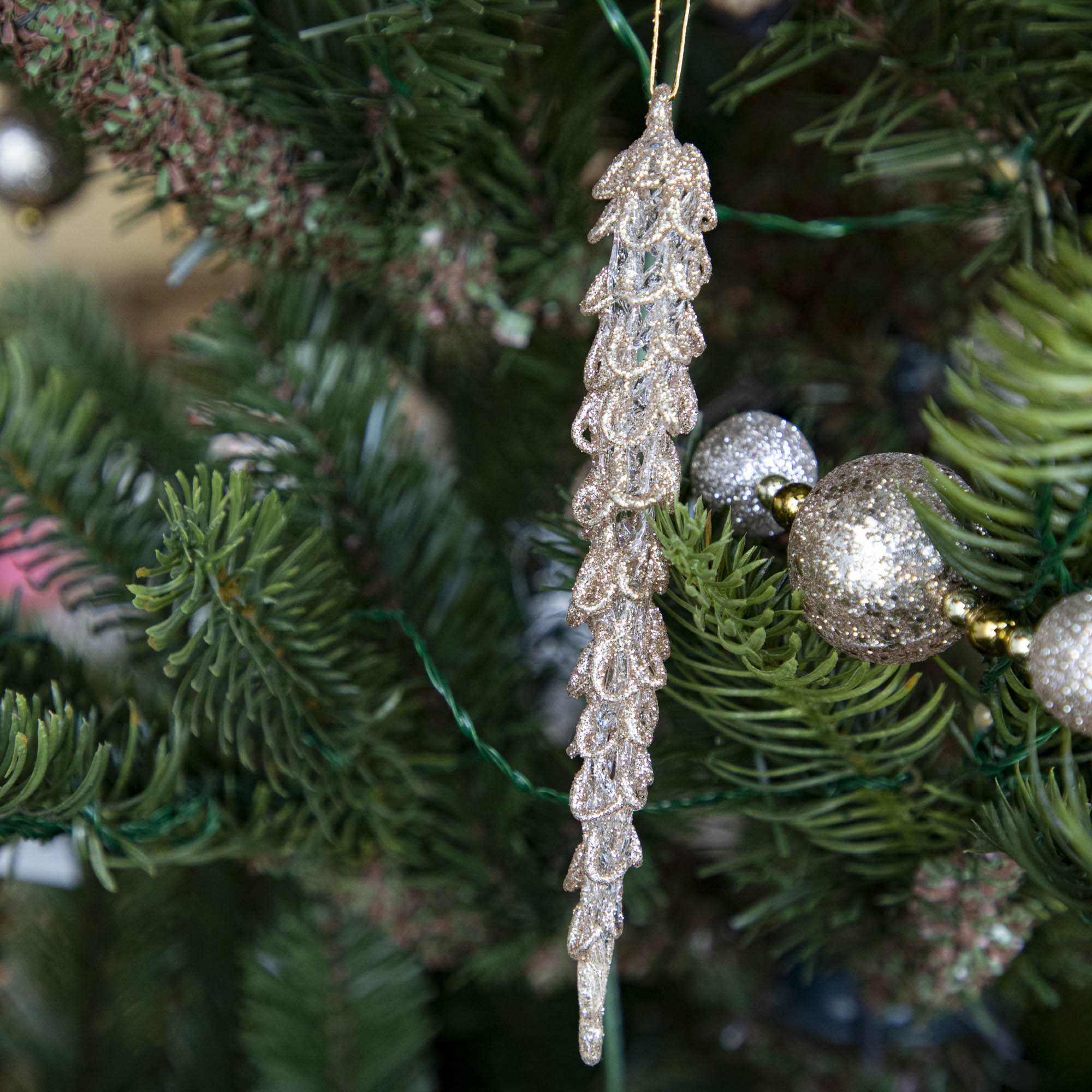 Spun Glass Icicle in Champagne Gold Glitter