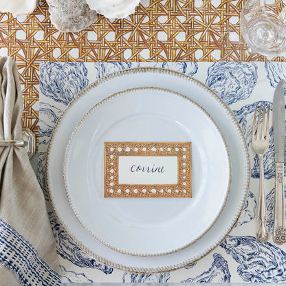 Blue Oyster Reef Placemat under a place setting on a sea themed table.