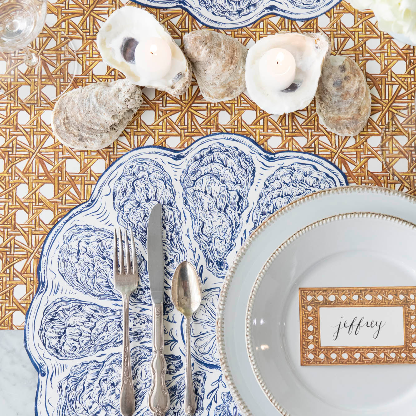 Rattan Weave Runner under a nautical themed table setting, with the Die-cut Blue Oyster Placemat on top.