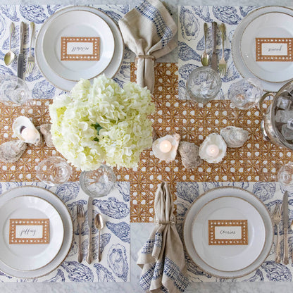 Rattan Weave Runner under a sea themed table setting for four.