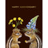 A dark brown greeting card featuring a charming illustration of two chipmunks wearing flower headdresses, with the words "HAPPY ANNIVERSARY!" printed in gold foil. 