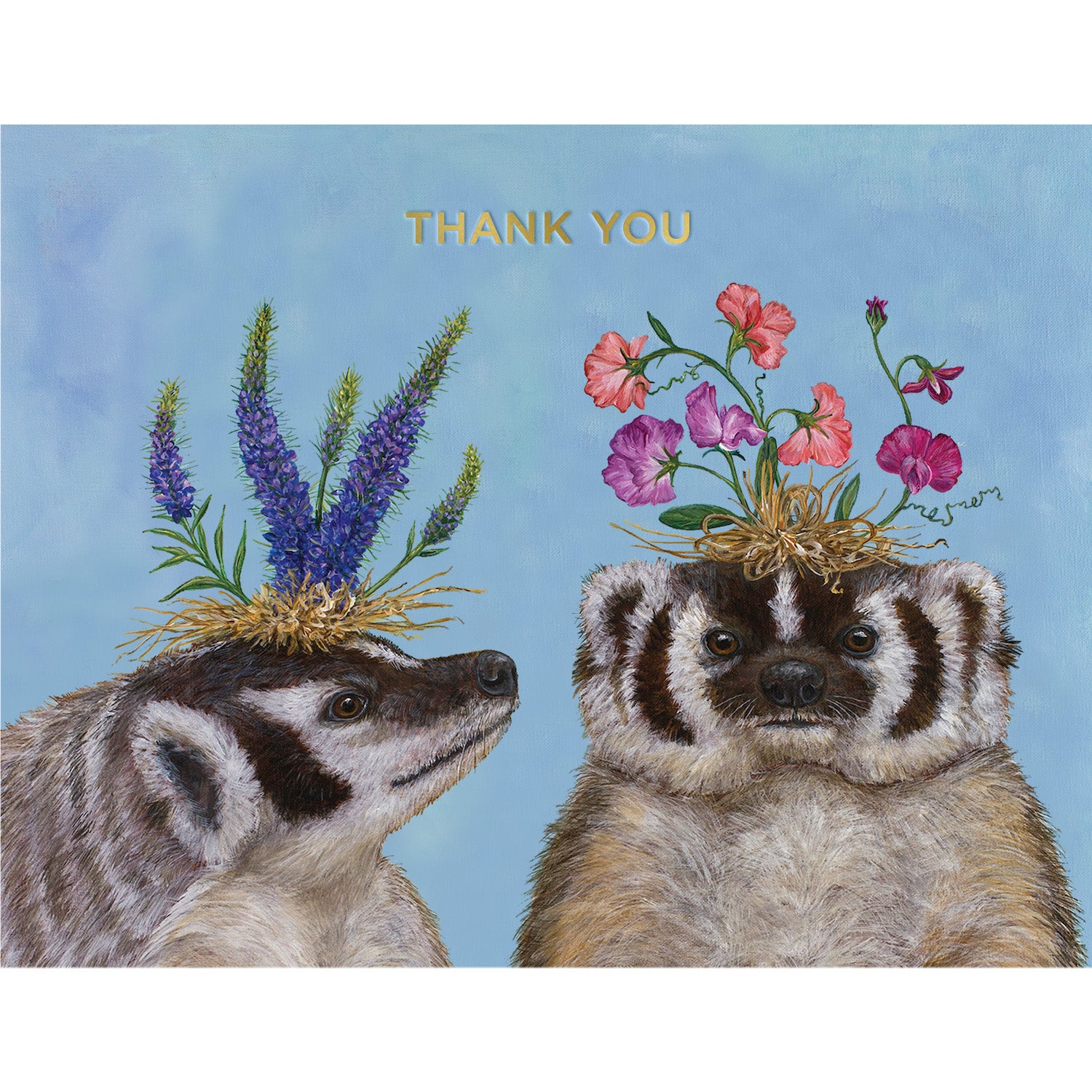 This card features whimsical artwork by Vicki Sawyer of two badgers with flowers on their heads on a sky blue background. There is a message that reads &quot;THANK YOU&quot; in shiny gold foil across the top. 