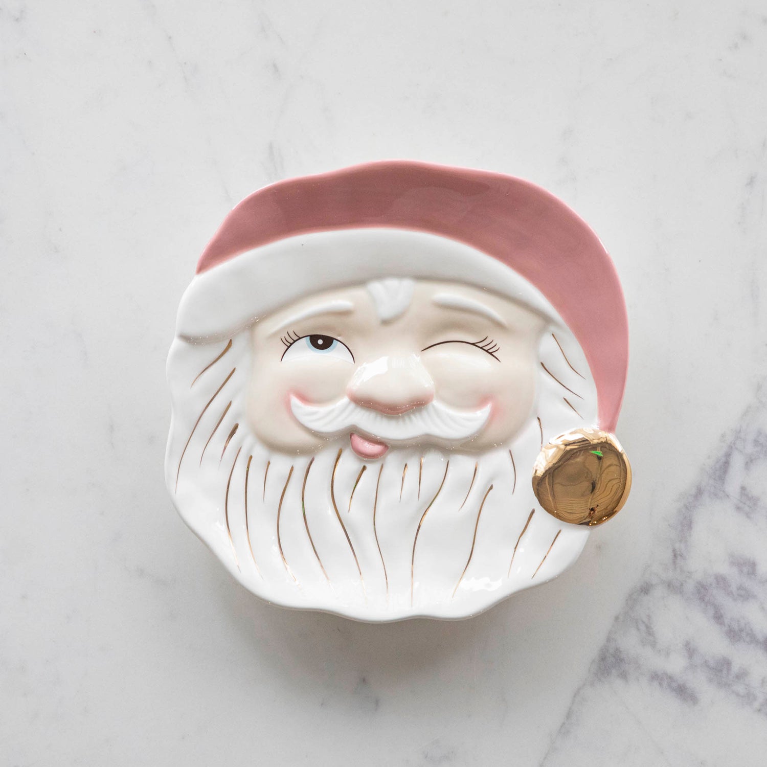 Papa Noel Mint Cookie Plate with one eye closed, a jolly face, and a pink hat with a gold painted pom.