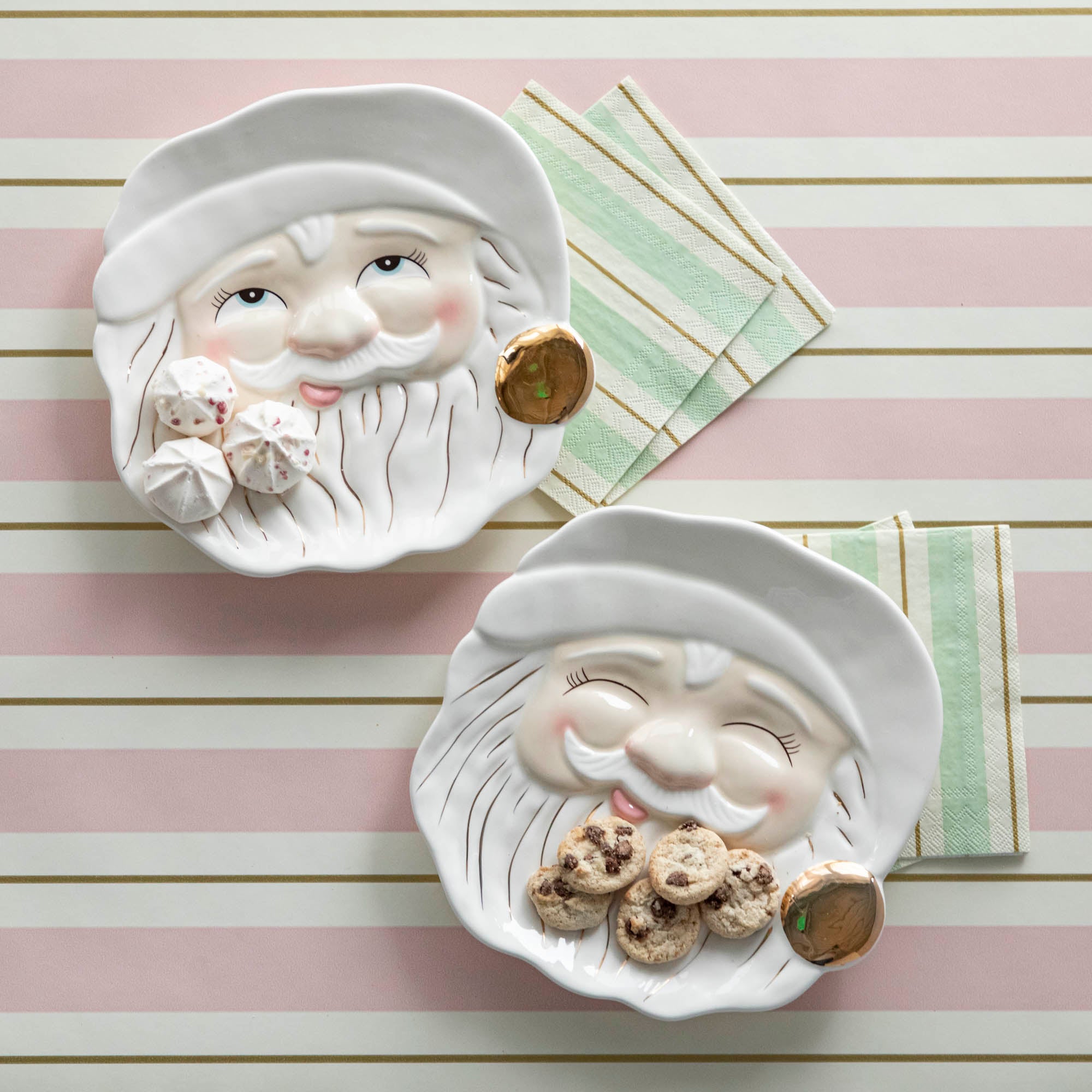 Two ceramic plates with Santa Claus faces on them, named Cream Papa Noel Cookie Plates.