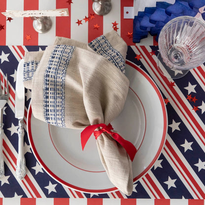 The Stars and Stripes Placemat under a patriotic place setting, from above.