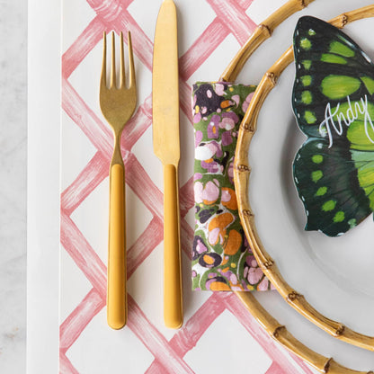 Pink Lattice Placemat under a spring themed place setting.