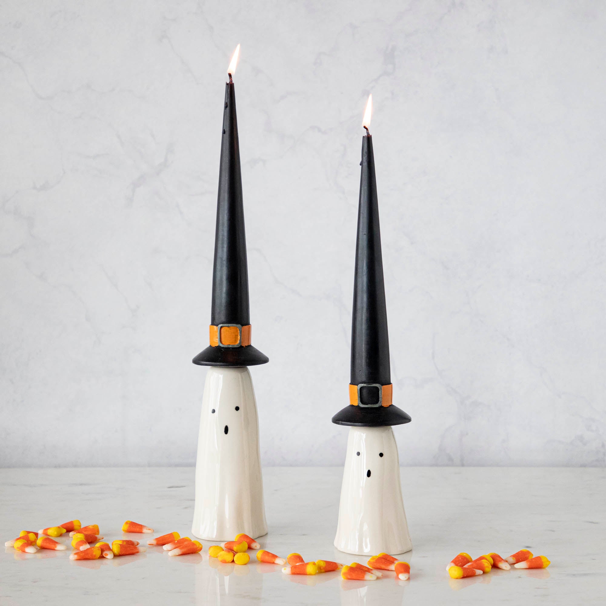 Three Phantom Candleholders from Accent Decor with candy canes on them.