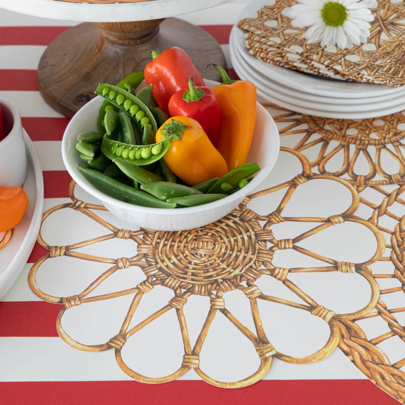 Rattan Weave Serving Papers under a bowl of peppers and snap peas.