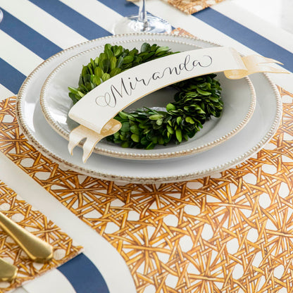 Rattan Weave Placemat vertically under a place setting.