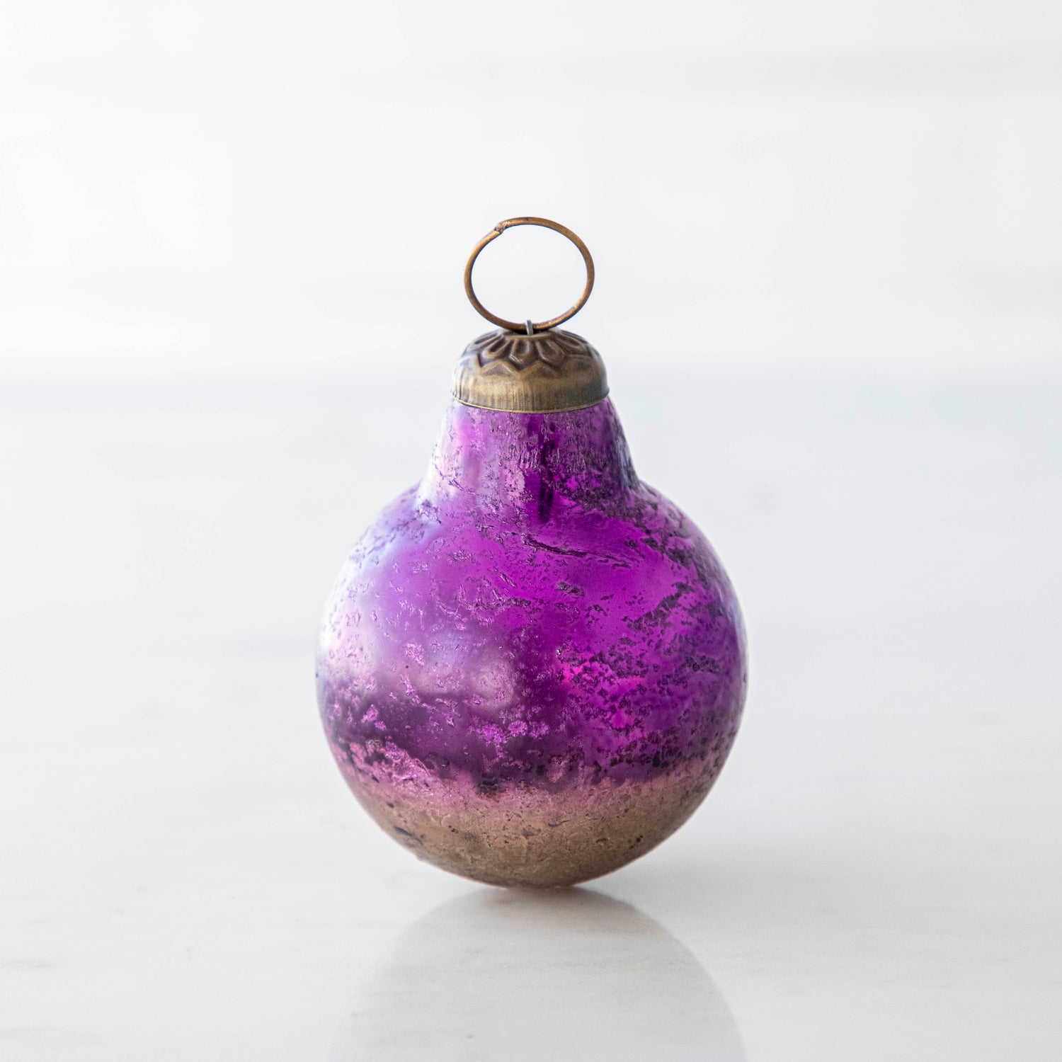 Purple Kugel Ornament on a white background