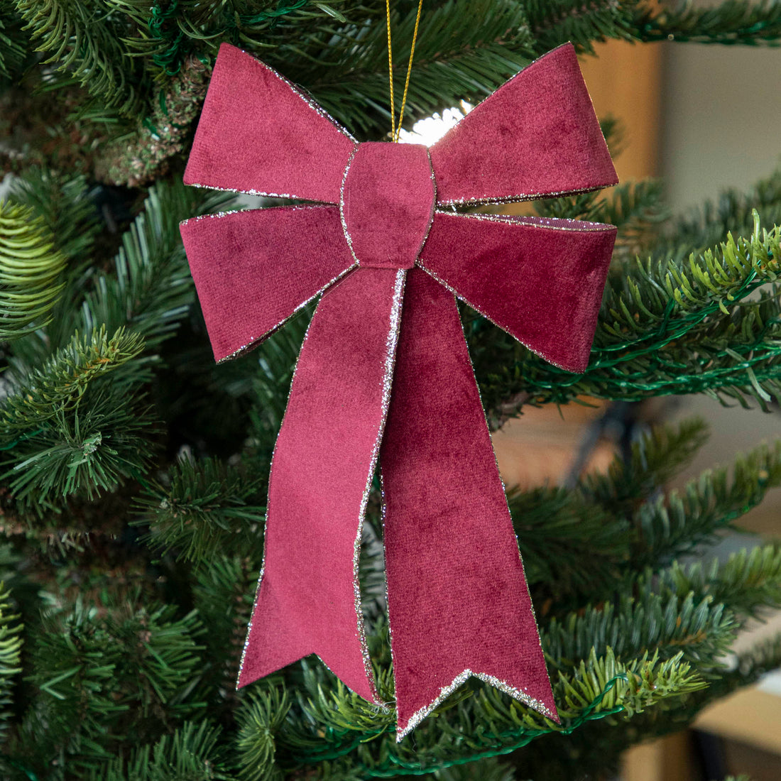 Burgundy Velvet Double Bow with silver glitter on edges hanging in tree