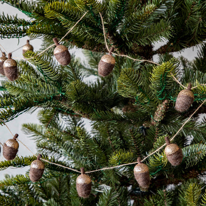 Woolen acorn garland strewn around a tree