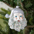 5" Glass santa ornament featuring a silver glittered beard, a silver star glittered hat and bright blue eyes, hanging from a silver string.